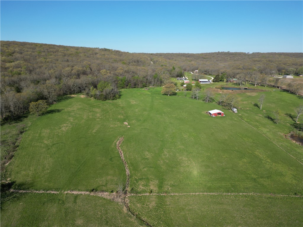 Very nice 26 acres with a 30x30 barn, just recently surveyed. What a great place to build your home on the wooded hill top above the pond and looking down over the pasture where your cows/horses graze. Pasture has been used for square bale hay production in the past. Looking for privacy, this acreage provides that by being at the end of the road. Shown by Appointment Only.