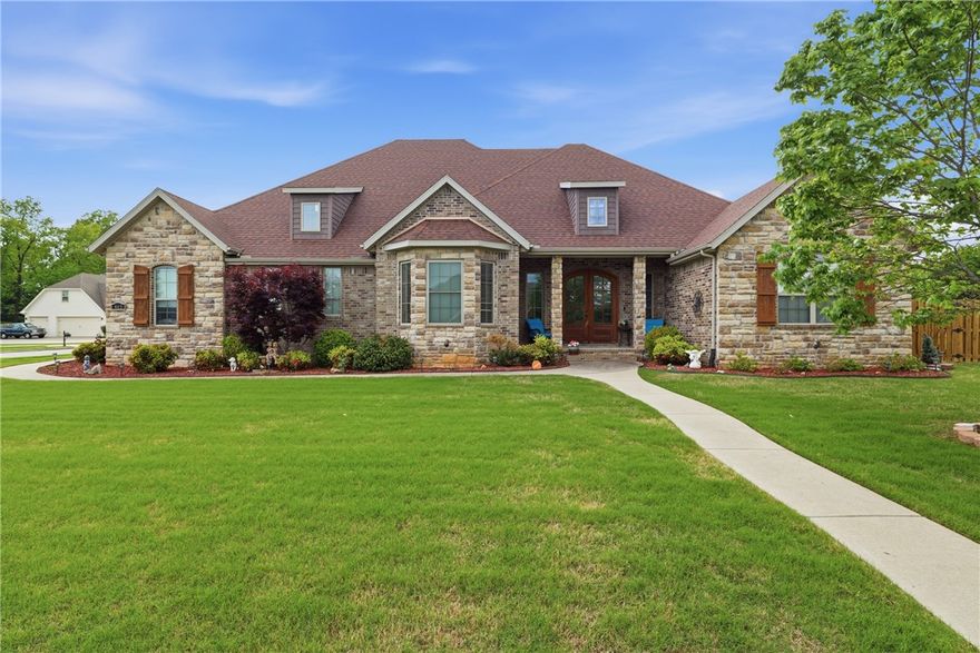 Experience the best of Farmington in the sought-after Twin Falls subdivision. This stunning, one owner, custom home on a large corner lot offers the perfect blend of luxury and comfort. Step through the beautiful wood doors into an open-concept interior that impresses with soaring ceilings, a cozy rock fireplace, and abundant natural light. A spacious kitchen serves as the heart of the home and perfect for entertaining. Granite counters, custom cabinetry, a large island, gas cooktop, double ovens, and a walk-in pantry finish out this amazing space. The split floorplan offers a private large primary suite and 3 bedrooms on the opposite side of the home. Step outside to your personal backyard retreat to experience beautiful sunsets in your screened-in covered patio with adjustable sun shades, gas fireplace, and TV providing an exceptional setting for relaxing in privacy. 3-car garage has plenty of room for projects, hobbies, or a home gym. Whole house vacuum makes cleaning a breeze! New gas water heater APR 2026.