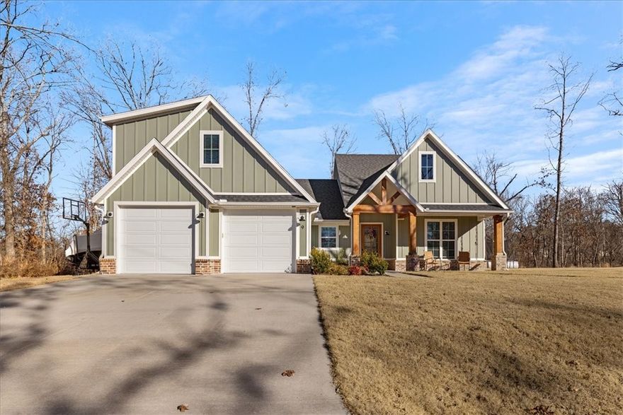 Custom home with high-end finishes and thoughtful design throughout. Features abundant cabinetry and built-ins, cedar accents, shiplap, pocket and barn doors, and wide wood flooring. Oversized 7’ windows fill the home with natural light. Kitchen boasts ceiling-height cabinets, 36" gas cooktop, apron sink, pot filler, wall oven, and island with hidden microwave. Primary suite includes walk-in closet and oversized spa-style shower. Secondary bedrooms have walk-in closets and extra lighting. Bonus room has full bath, large closet, and its own dual-fuel HVAC. Additional highlights: mudroom, laundry with cabinets and folding station, insulated garage doors, Hardi siding, and fully sodded yard. Oversized flat lot, minutes from Bella Vista’s largest lake and Highlands Golf Course.