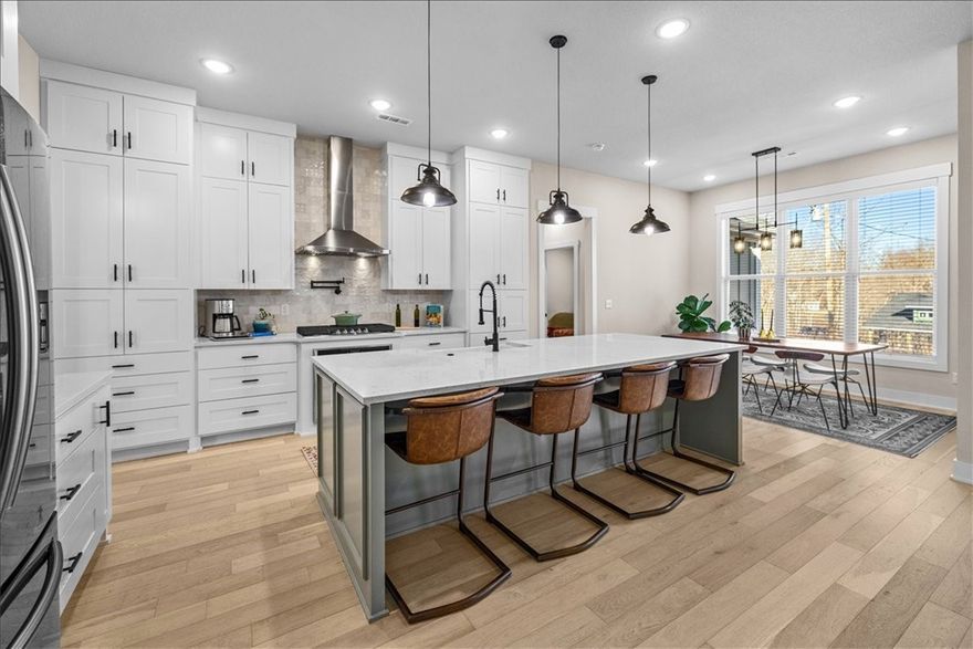 Custom home with high-end finishes and thoughtful design throughout. Features abundant cabinetry and built-ins, cedar accents, shiplap, pocket and barn doors, and wide wood flooring. Oversized 7’ windows fill the home with natural light. Kitchen boasts ceiling-height cabinets, 36" gas cooktop, apron sink, pot filler, wall oven, and island with hidden microwave. Primary suite includes walk-in closet and oversized spa-style shower. Secondary bedrooms have walk-in closets and extra lighting. Bonus room has full bath, large closet, and its own dual-fuel HVAC. Additional highlights: mudroom, laundry with cabinets and folding station, insulated garage doors, Hardi siding, and fully sodded yard. Oversized flat lot, minutes from Bella Vista’s largest lake and Highlands Golf Course.