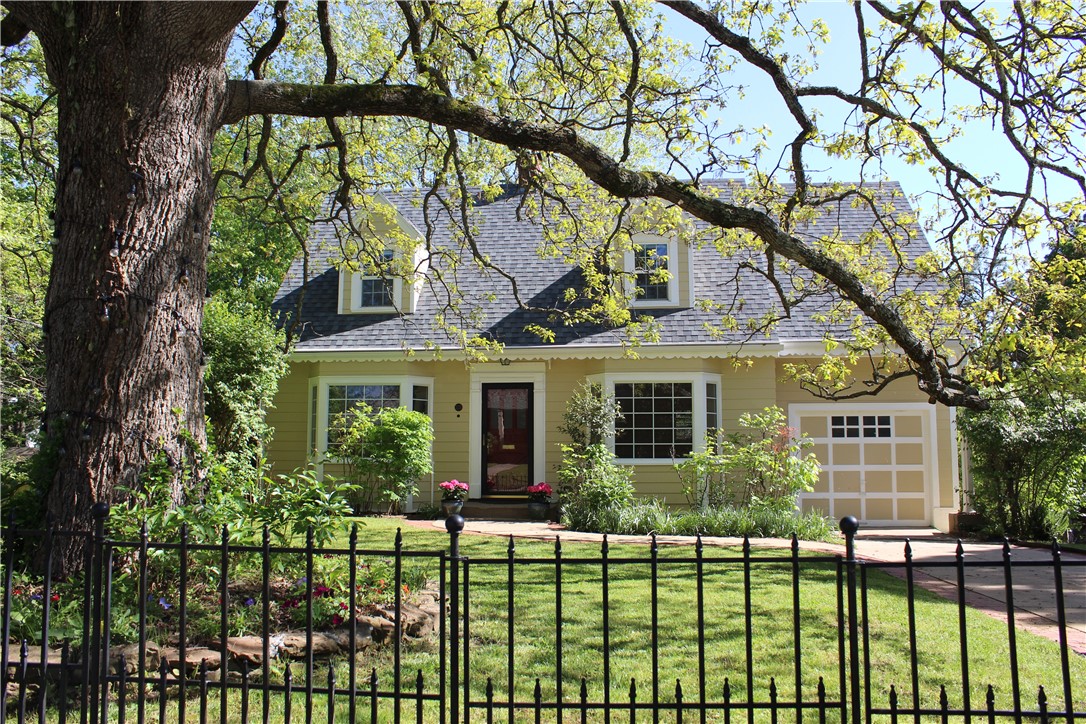 Location, location, location. This fabulous mid-century home sits on a tree lined street in the heart of Fayetteville near Razorback Greenway, Wilson Park, Gregory Park and Downtown Proper. This home has been updated throughout. It features 3 bedrooms, 2 full baths and 1 half bath. The walk out basement could also be used as additional office or bedroom space. Custom built in 1948, this home has timeless traditional style featuring arched doorways, original hardwood floors, walk-out basement, lots of natural light, built ins, and sits on a corner lot. It has an attached garage as well as a carport. This home is fabulous for entertaining with beautiful trees and large backyard. Light and bright walkout basement with separate entrance allows for guests to have their own private space while visiting. Walking distance to Gregory Park, UofA, and downtown area. Don't miss the opportunity to own this amazing home in a vibrant neighborhood in the heart of Fayetteville Arkansas.