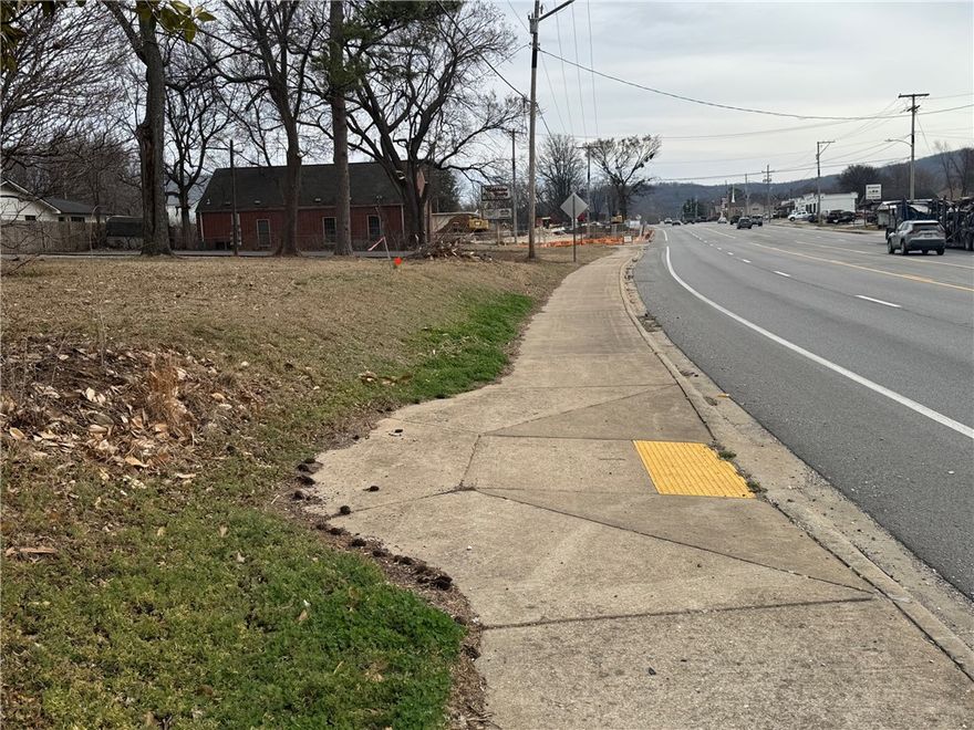 Large commercial tract in Farmington with appx 300 ft of Hwy 62 frontage in 2 parcels. Zoned commercial. Lots of options, very close to McDonald's, Sonic, Dollar Tree & First Security Bank. 36,000 traffic count