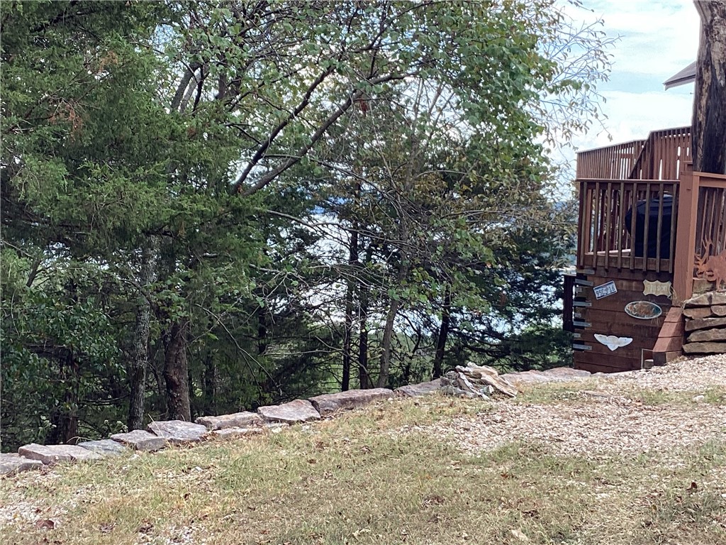 How about a lovely buildable lot with ALL UTILITIES in Lost Bridge Village for your family's dream lake house! 30 minutes back to Rogers and civilization; but miles away from the noise and clatter of the big town. A seasonal view will open up to the SE across Oak Leaf Circle. The Lake life is yours for the taking! Living in Lost Bridge will grant you access to the clubhouse, tennis court, library, swimming pool and community boat ramp!