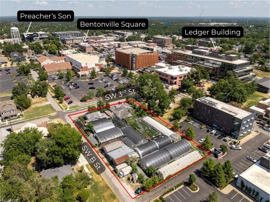 Commercial property located on a large 0.96-acre corner in the heart of Downtown Bentonville. Positioned near Skylight Cinema, the Ledger Building, and surrounded by the city’s thriving dining, entertainment, and retail scene, this property sits at the center of Bentonville’s continued growth. Featuring 123 feet of frontage along SW 3rd Street and 287 feet of frontage along SW B Street, it offers exceptional visibility and accessibility for future business or redevelopment opportunities. Currently operating as a flower shop and greenhouse, the site presents a unique chance to reimagine one of the most sought-after locations in Northwest Arkansas. Just 1.5 miles from the new Walmart Home Office and minutes from world-class mountain biking trails, this property combines prime location with endless commercial potential. Existing Greenhouse, and Flower shop business are NOT part of sale."