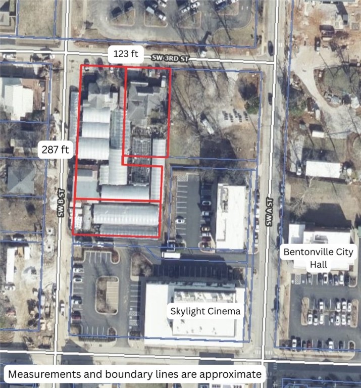 Commercial property located on a large 0.96-acre corner in the heart of Downtown Bentonville. Positioned near Skylight Cinema, the Ledger Building, and surrounded by the city’s thriving dining, entertainment, and retail scene, this property sits at the center of Bentonville’s continued growth. Featuring 123 feet of frontage along SW 3rd Street and 287 feet of frontage along SW B Street, it offers exceptional visibility and accessibility for future business or redevelopment opportunities. Currently operating as a flower shop and greenhouse, the site presents a unique chance to reimagine one of the most sought-after locations in Northwest Arkansas. Just 1.5 miles from the new Walmart Home Office and minutes from world-class mountain biking trails, this property combines prime location with endless commercial potential.