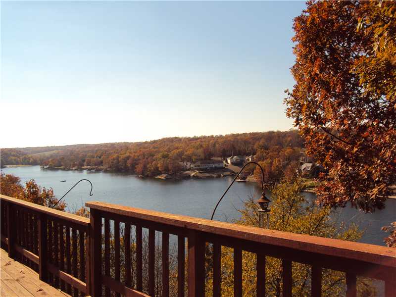 From an eagles point of view this is the best location on Loch Lomond. This updated home offers 2,077 square feet on one level and an additional 700 sq. ft. of storage/hobby room on lower level. A spacious living area is highlighted by a vaulted ceiling,& wall of windows looking across deck & lake. Corner of family room features a gas-log fireplace. Dining area occupies the heart of living areas between family room, sunroom & kitchen. Kitchen offers large center island. Steep descent to water. No dock.