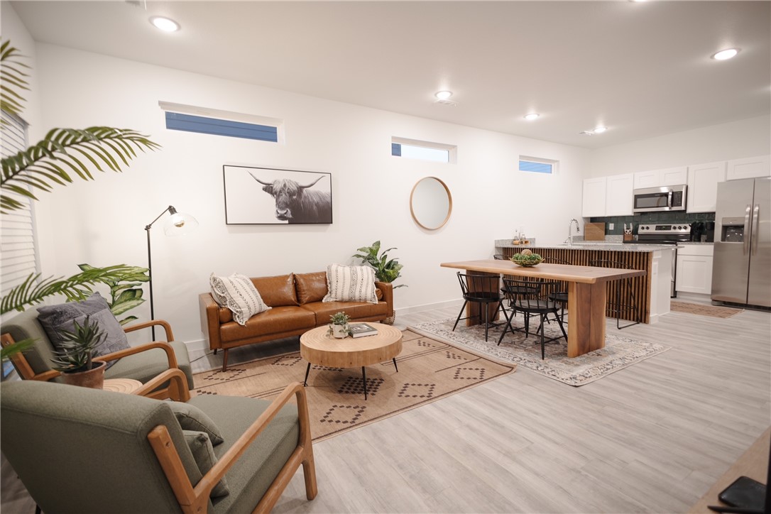 Modern, move-in ready, and fully furnished, this vibrant 2 bed, 2 bath townhome in Featherston Village is the perfect blend of lifestyle, location, and investment potential. Just 9 minutes to downtown Bentonville and within the Bentonville School District, it's a prime opportunity for investors or homeowners. Currently operating as a successful Airbnb with 100+ reviews, this turnkey property features granite countertops, vinyl plank flooring, and a versatile bonus room on the main floor. Low-maintenance living means you’ll never worry about mowing again. All appliances included—refrigerator, washer, and dryer. Enjoy access to community amenities like a dog park, walking trail, tennis, and pickleball. Whether you're expanding your short-term rental portfolio or seeking a stylish home in one of NWA’s hottest areas, this one checks all the boxes. Don’t miss out—schedule your private showing today. Call today don't miss this great opportunity.