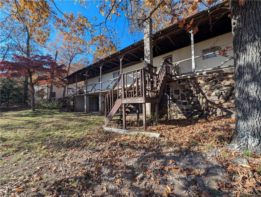 Your own private cabin on 9.11 wooded acres, with a 30 x 30 shop building, close to the Buffalo National River.  Private well and septic.  Good hunting spot right outside your back door.  Single-wide has been occupied for over 20 years and is now ready for you to give it your own updates and personal touches.  Everything you see there, STAYS. The back of the property has a cement pad for possible patio, storage or carport.  Also enclosed potting area for your green thumb projects. The shop has several great work benches and the floor is equipped with a Grease/Inspection Pit, 12ft overhead door and side carport area.  Don't let this one slip away.