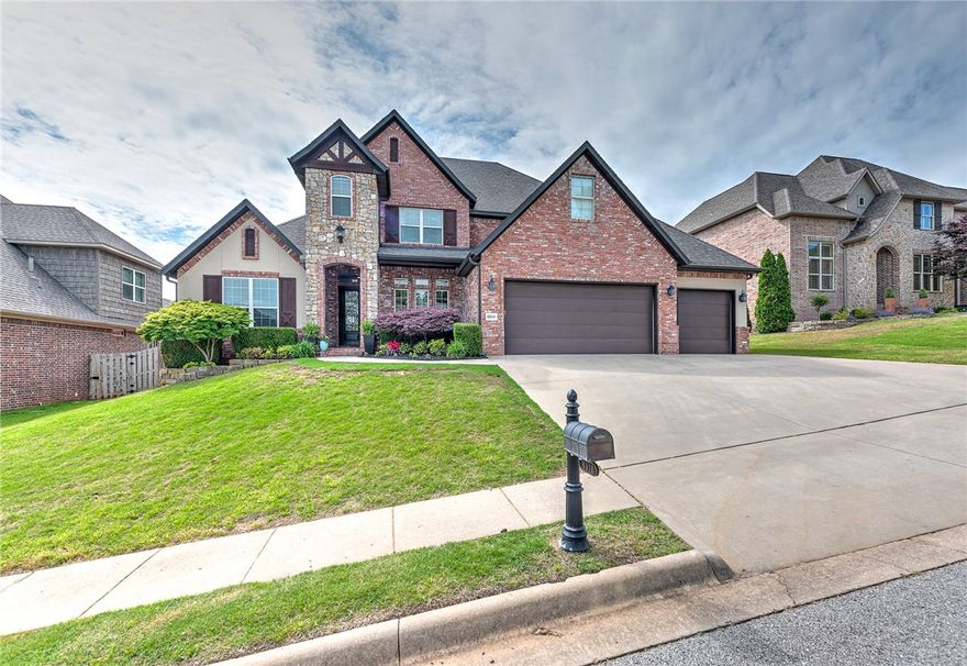 Stunning home nestled on an a very nice, fenced, private lot inside highly sought after Shadow Valley gated golf community in Bentonville School District. The 5 bdrm, 4.5 bath open floorplan, has  an office on main level, a 2nd living room on main level, a large media room on 2nd level as well as a 2nd level attic area that has mechanicals and makes a great storage. Walk in to the grand entrance w/ 12 ft ceilings, upgraded designer lighting, whitewashed stone gas fireplace, home audio surround sound & hardwood floors. Entertain in the formal dining room or gourmet kitchen w/ gorgeous granite countertops, built-in island w/ wine fridge, double ovens, walk-in pantry, built-in seating area & adjacent storage lockers. 1st floor also includes the master suite & 2nd bdrm w/ full bath. 2nd level features 3 bdrms w/ large walk-in closets, media room & 1 walk-in attic space. Too many updates to list but have a list that can be sent on request.