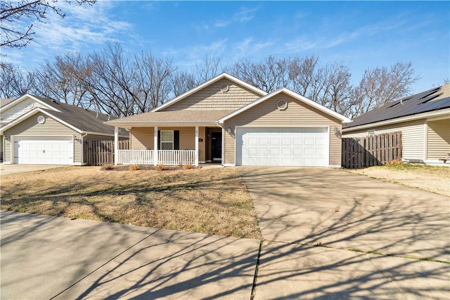 Settled less than a block from Holland Park and a mile from Creekside Park, this 3 bed 2 bath home sports mature trees, private fenced yard, spacious open living room, kitchen with under cabinet drop down knife block, 2 car garage. One mile from Kessler mountain, paved sidewalk to the greenway, and 10 minutes to the U of A or Hwy 49. Bike to a restaurant for dinner? Bike to Creekside park for frisbee golf or pickle ball. Take the kids to school via bike trail. This place has it all! Call it home or your next great investment property! Washer, dryer, and refrigerator convey.