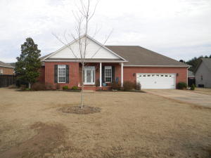 Beautiful 4 bedroom home in Cove Landing. This home features a split bedroom floor plan, a spacious kitchen with granite counters, and a large open living area with tall ceilings and a cozy fireplace. The master bathroom has a double vanity, double walk-in closets, shower, and a jetted tub. The covered back porch and huge deck are perfect for grilling and relaxing at the end of the day. Don't miss seeing this lovely home. (Recently painted and new carpet)