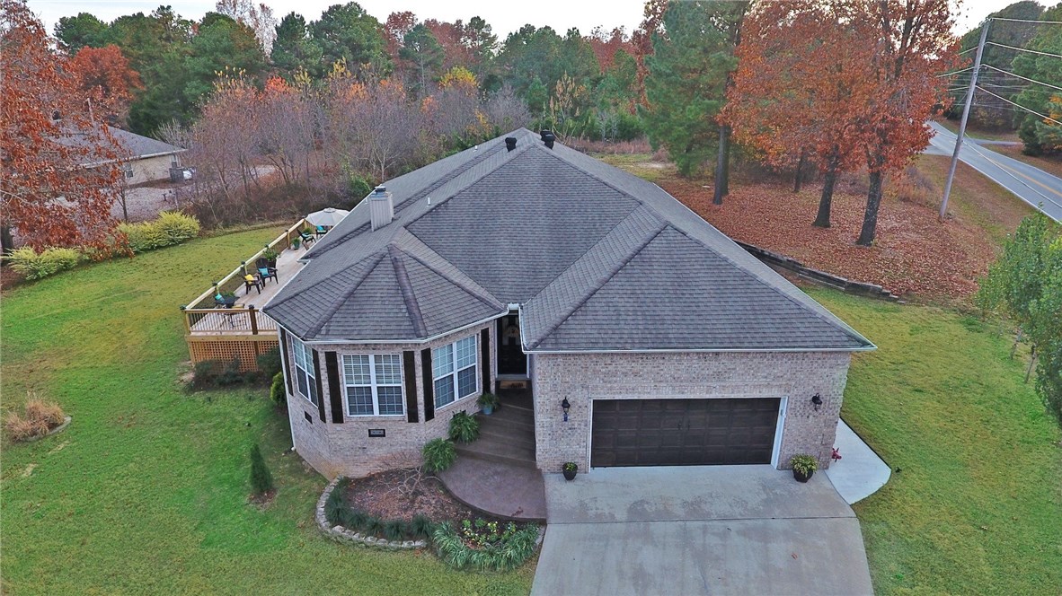Newly renovated brick home on rare double lot. Kitchen has 10 foot granite island/custom cabinets/new Kitchen Aid appliances. Double pane windows w/tilt slash brings in natural light. Enjoy entertaining on large deck. Master BA features garden tub & walk-in shower w/triple shower heads. Spacious bedrooms & well-appointed baths. Fully finished basement could be media room, gym or extra master suite. Three-sided fireplace w/remote divides main living from kitchen/dining area. Custom home w/lots of extras.