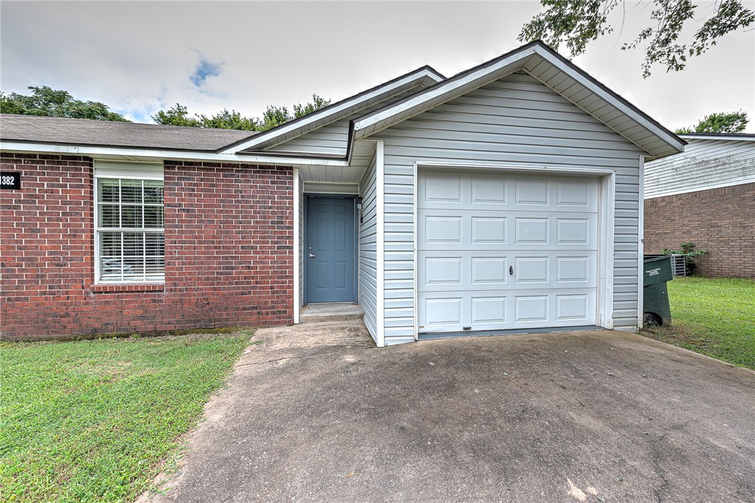Excellent starter home or investment property in West Fayetteville! Freshly remodeled townhome (3 bedroom, 2 bathroom, 1 car garage) with new flooring, paint, counter tops, refinished cabinets, new sliding patio door, and new lighting & plumbing fixtures throughout. Brand new kitchen appliances including Refrigerator! Washer/dryer hookups. Kitchen Pantry. Conveniently located less than 2 miles from I-49 and only 3.5 miles to the UofA. Close to bus routes, schools, shopping, restaurants, and all amenities Fayetteville. Come see this property today! Listing is for the single townhome unit on the right side. The unit on the left side (1384 N Boxley Ave) is also for sale separately, see ML#1319926.