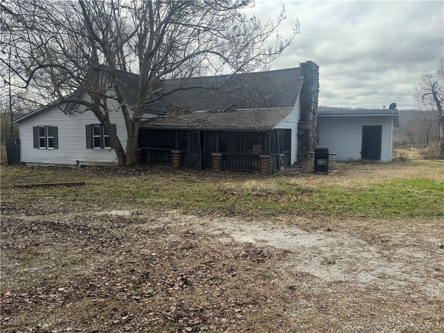 3.54 acres with all utilities! 3/2 house with no value. 22x18 shop with cement floors. Build your custom home on the back of the property & have room to build a second home on the front for income or family