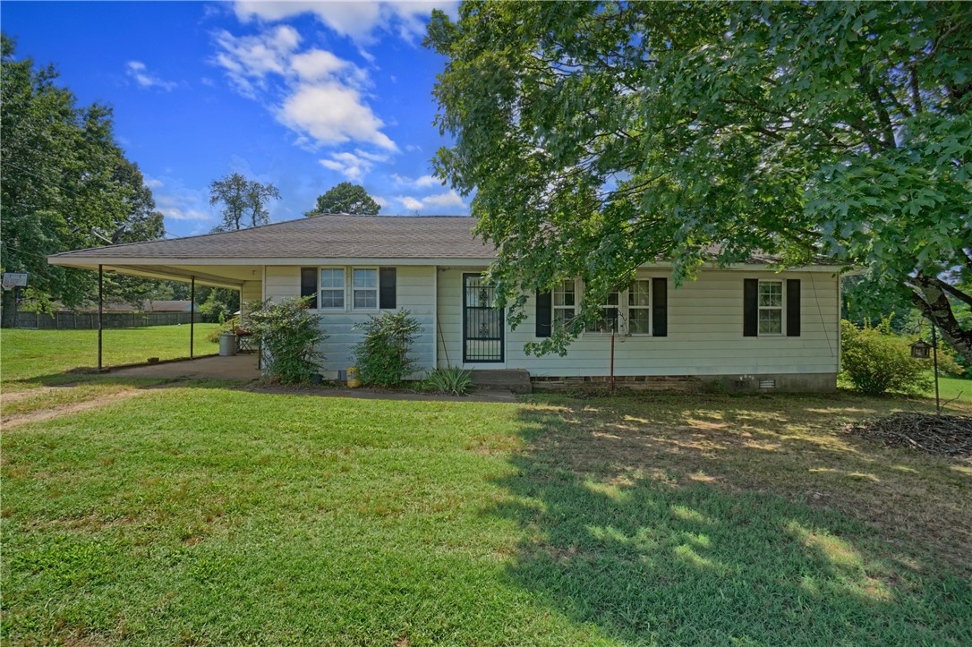 Nice home in hard to find price range located in the heart Hector. If affordability is a priority check out this 1168 sq foot two bedroom two bath home that is ready to move into. The house is solid as a rock and could have a third bedroom if you wanted to make the conversion. Out side there is a great yard with almost two acres, a storm cellar and a great shop. Don't let this one slip away.