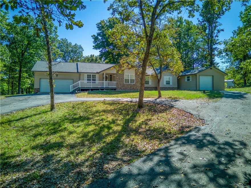 Located just outside of town on all paved roads, this 3-bedroom, 2-bath home sits on a little over 5 acres in a well-established neighborhood. A paved circle drive leads to the home and a split driveway entrance, with a shared drive access near a neighboring property. Enjoy outdoor living on the screened-in back deck, along with ample storage and workspace in the 30x30 shop and two garages with four-car capacity. Offering both privacy and convenience, this property combines comfortable living with practical amenities.