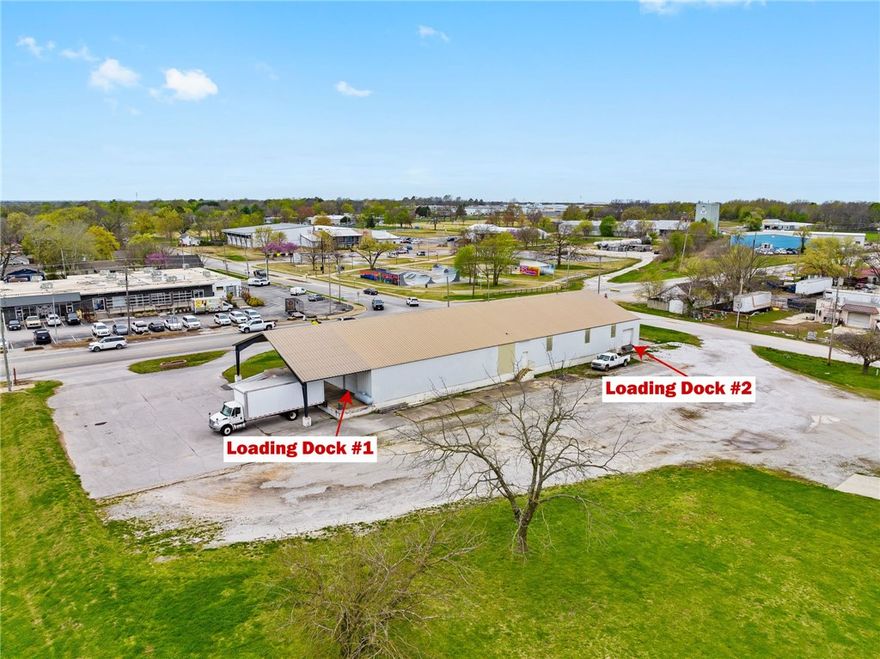 Prime +/- 9,000 SF warehouse/office space available near Downtown Rogers! This high-visibility
property on busy 2nd St offers excellent exposure with an impressive traffic count of approx. 15,000
VPD. The building features two loading docks, one with an 8' tall door and the other with a spacious
10'x10' door. Inside, enjoy tall ceilings with a maximum height of 21.5 feet at the center and 12 feet
along the sides, perfect for flexible storage and workspace needs. The layout includes two offices and a
private restroom, all set on a sprawling +/- 1.8 acre lot, providing ample space and accessibility. A strategic location, flexible layout, and strong visibility make this an outstanding opportunity for businesses ready to expand or establish a presence in Rogers.