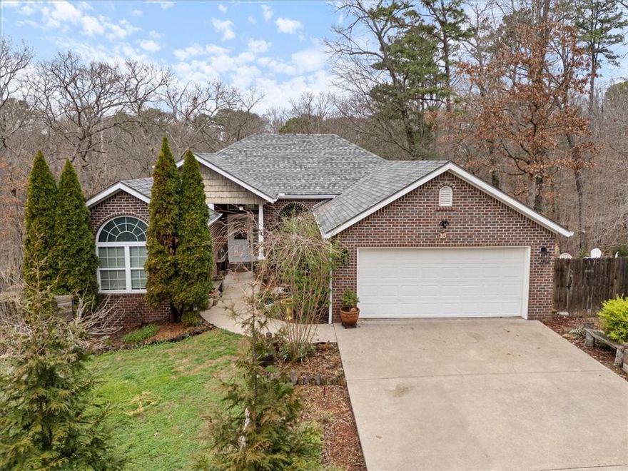 Enjoy a Bella Vista lifestyle. Spacious 4BR/3BA home. apprx. 2,824SF on two combined lots for.77 acres. Short drive to Hwy 71B for easy Bentonville access. Surrounded by wooded views, the home features a cathedral ceiling living room w/gas-log FP, wood flooring & abundant natural light. Kitchen offers freshly painted cabinets & pantry storage. Appliances only 3 years old w/great flow to dining/ living spaces for everyday living/entertaining. Split floor plan provides privacy for primary suite w/walk-in closet & spacious bath. Finished walk-out basement w/second living area, additional bedroom & full bath, office/den and bonus area with mini-kitchen space ideal for guests, hobbies or work-from-home flexibility. Enjoy the deck/patio overlooking Bella Vista’s peaceful natural setting, relax in the hot tub and pick fresh fruit from your own peach tree for homemade cobbler. 2026-New roof, gutters, heat pump/one HVAC for downstairs add peace of mind. Minutes to lakes, golf, mtn bike trails, clubhouse & community pool.
