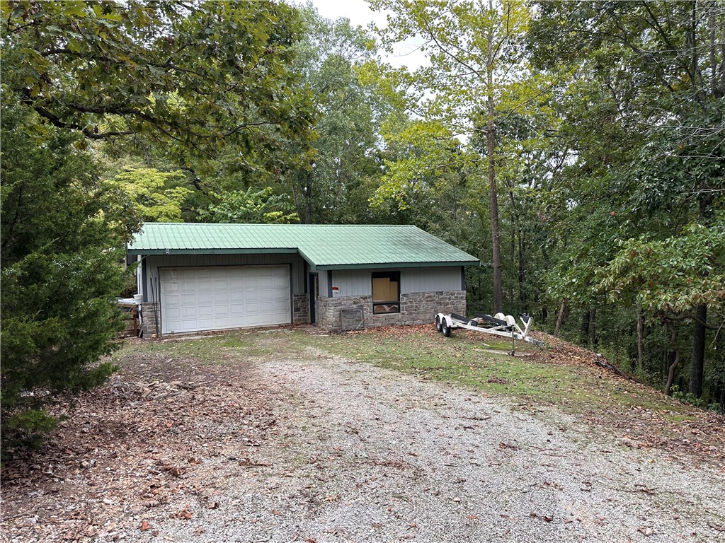 Great Beaver lake area unrestricted 1.76 acre lot. Garage is already in place and could be remodeled into a weekend get-a-way or vacation cabin. Would also make a great boat storage as the property is only a short drive to Starkey Park and beautiful Beaver Lake. Check it out now before it's gone!