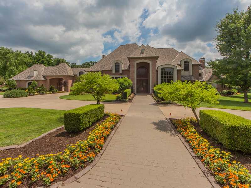 Private gated Estate fully furnished. Close to Crystal Bridges & Downtown Bvill. Lush grounds w/extensive landscpaing. 2.5 Ac. Stocked pond w/dock & gazebo. Inground Salt water pool & spa w/slide, diving board & waterfall. 6 car,garage. Limestone & hand scraped wood floors, Thermador appliances, Sub-zero refrigerator & freezer. Game room w/wet bar & pool table. Media Room, Master Wing & additional guest room on main level. Exercise room. 2 laundry rooms. Heat/Cool workshop.