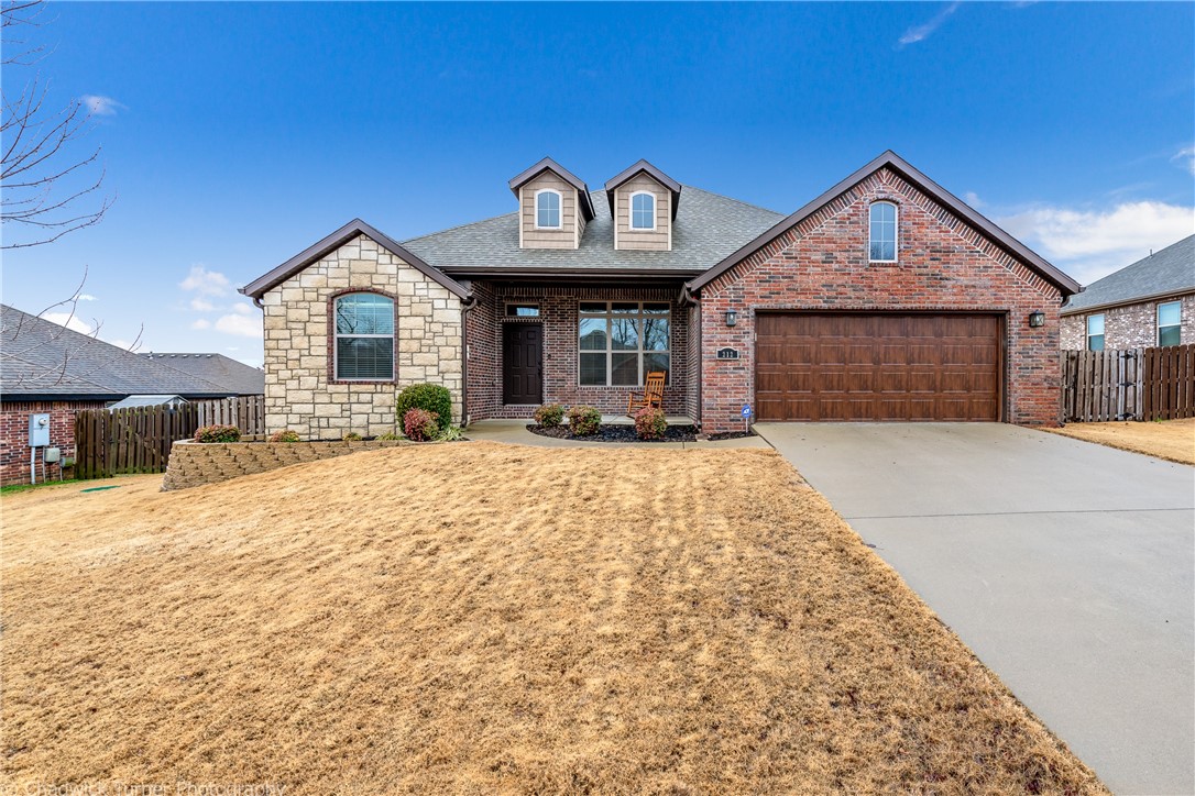 Impressive home in a well maintained & desiredĀ subdivision, minutes to I-49! Eye catching curb appeal along withĀ many greatĀ features to hold your interest. Beautiful landscaping, a delightful front porch for enjoying conversation & a beverage with neighbors. Lovely open & split floor plan highlighted with handsome wood flooring flowing through the main living area, 2nd bedroom & owners suite.Ā Ample space, counter tops & storage in the kitchen are all ideal for functionality while preparing meals or for gathering with friends & family. Enjoyment easily continues on an extended covered deck in the back, plus a separate concrete pad for sunning, games or a hot tub!? Wide open flat backyard will supply all kinds of fun or relaxation. Not to miss an extraordinary 150 sq ft storage building attached to the home. Find more storage in the large utility room complete with a floor to ceiling cabinet. Noteworthy above ground storm shelter, sealed flooring, pull down attic storage & insulated doors in the sizable garage.