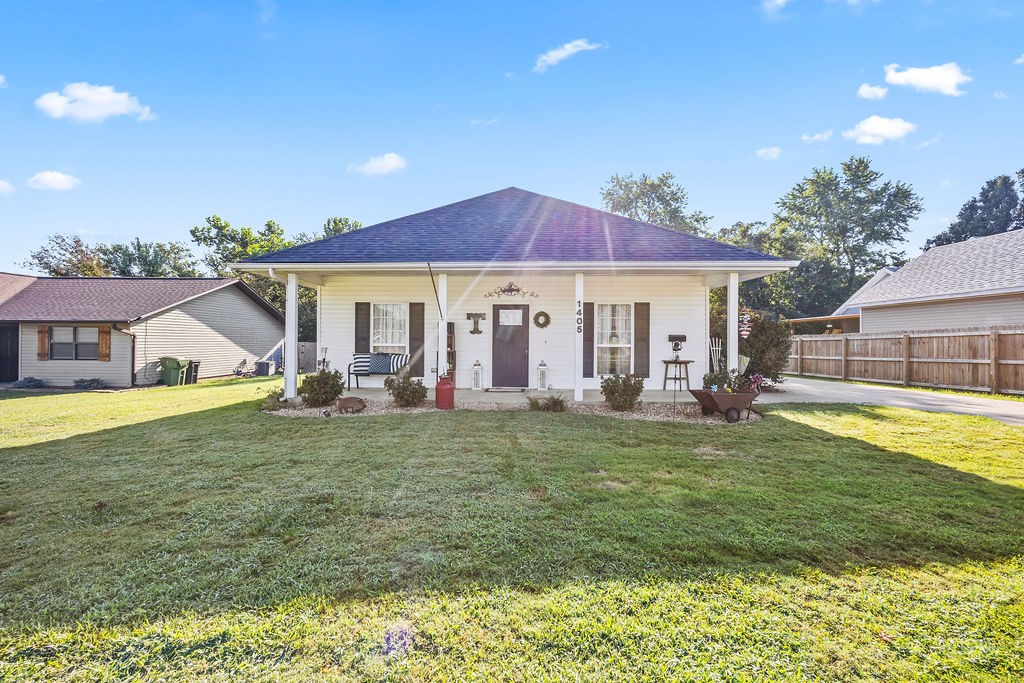 Welcome to 1405 S. 5th Street! This cute little home was built in 2006 & sits on a nice flat lot that is located directly across the street from the Rogers Heritage High School, making it a prime location! Downtown Rogers is less than a mile away making it super close to good food & the bike trails. The exterior of the home has great curb appeal w/nice landscaping, a long driveway, & a good sized detached 2 car garage. The home had a new roof put on earlier this year, a newer natural gas water heater, & the HVAC system was just serviced. From the outside, the home may look small but walk inside & find a floorplan that used every inch of square footage. Inside the home offers 3 cozy bedrooms w/good sized closets, a separate dining room, good sized kitchen w/black appliances, & a nice size living room to relax after a hard days work. Oh yeah, the backyard has a huge deck for entertaining & a small fenced in area for the dogs! This house is 100% Move in Ready & will make one special family very happy!