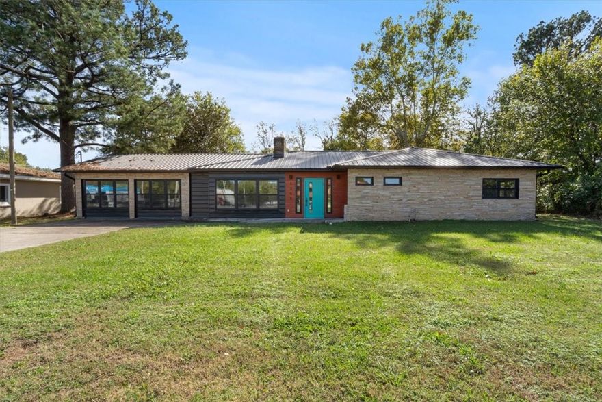 Expansive 2,349 Square Foot Commercial Space with a metal roof and striking rock and metal exterior. The enclosed garage boosts the functional layout, and the entire property offers central heating and cooling for year-round comfort. Inside, two bathrooms and a potential kitchen area provide convenience and flexibility, with an open, unfinished floor plan ready for creative customization. Situated on a .56-acre lot with limited onsite parking, it stands out in a high-visibility corridor near local businesses and amenities, offering adaptable possibilities for a variety of future uses. Buyer to verify all zoning, use, and permitting requirements prior to purchase