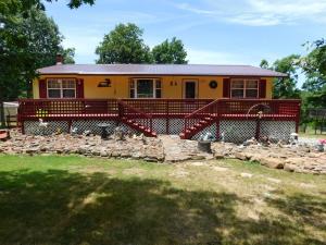 Nice, open floor plan, updated kitchen with granite countertops and 2 yr old stainless appliances, large living room with gas fireplace. Large front deck and covered back deck. Finished basement with gas fireplace and workshop area.