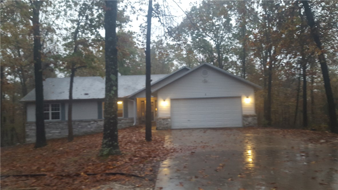 Your home for the Holidays. Beautiful wooded setting surrounds this spacious and open ranch style home. Brand new kitchen appliances, HVAC, hot water tank less than a year old. New wood floors throughout. Amazing views. Walking trail system just across the street. Enjoy all that Bella Vista has to offer in this spectacular home in the heart of it all. Hard to find level yard is very private with plenty of trees for cover.
Home Warranty is included as is the SS refrigerator. Property starts at the corner for this home offers 2 lots.
