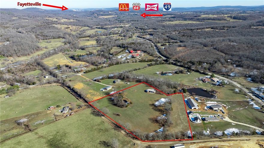 Motivated Seller says Make Offer! 7.58+/-acres w/hilltop building views is gently rolling, has a small pond, partially wooded & is rural but close to I-49 & many other places: 6mins to I-49 access, 8mins to Greenland, 10mins to Prairie Grove, 15mins to Razorback Stadium in Fayetteville.  Two separate locked entry gates offer options on how you want to access your property.  ($80K value) 2019 well-built 50x30 Shop/Barn Bldg w/Lean-To Shed for covered storage, thick concrete floor, three 10' garage doors & plumb access if you choose to install a bath.  This could be your barn-dominium ready to complete OR this is your Workshop & build your forever home here OR stay in your RV or MF housing while you build your main home onsite.  Electric & Public Water available to connect nearby, Propane needed for gas, Private Septic needed & a perc test allowed for 2-build sites for 3bdrm sized home.  Plat available for Tract #3.  Some farm equipment & supplies present in Shop have already been sold, but some are still negotiable.