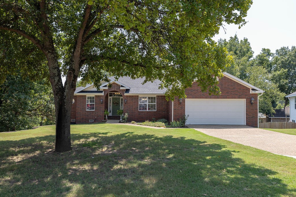 This is it! A beautiful home on large lot within walking distance of the Bentonville square, or step out your back gate directly onto the Apple Turnover Bike Trail. Ready to move your family into or market as a short-term rental with no restrictions, this home is spacious and gracious. Warm up in front of the gas fireplace in the living room, spread out in the lower-level bonus/media/game room that opens out to an oasis surrounding your inground pool, work from home in your private office with French doors and custom built-ins, then choose between the dedicated dining room or casual eat-in kitchen at meal time. LL wired for surround sound, including pool-side speakers. Massive storage/shop space in the unfinished portion of lower level with potential for additional square footage, this area could be finshed as a airbnb rental or whatever you choose. Washer/dryer, refrigerator, pool tools, swing set, and trampoline convey. New roof in 2023, new water heater in 2023, new Trane HVAC installed in 2020.