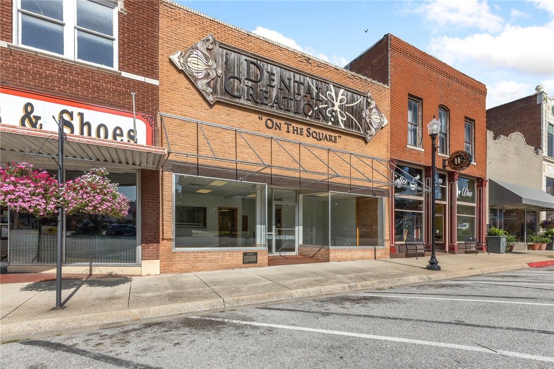Don’t miss the opportunity to own 6,480 finished sq/ft of flexible commercial space on the historic square in Harrison. Currently configured as a dental office, this property offers a versatile layout as all interior walls are non-load bearing, allowing you to customize the space to suit your needs. The main level includes: a waiting room, reception space, 4 offices, 6 operatories with CAT 5, water, vacuum & air at each station, 4 exam rooms, lab tech, touch-less sinks, 5 bathrooms (4 half, 1 full), including 2 ADA-compliant restrooms and more. Upstairs features a large open space, kitchen with dishwasher, washer/dryer hookups, a half bath and additional storage, making it ideal for expanding operations or even converting to loft-style living or co-working space. Added benefits: HEPA air filtration system w/ 6 filters in the operatory rooms. Whether you're an investor, medical professional, or entrepreneur, this property delivers unmatched potential in a prime location with consistent foot and vehicle traffic.