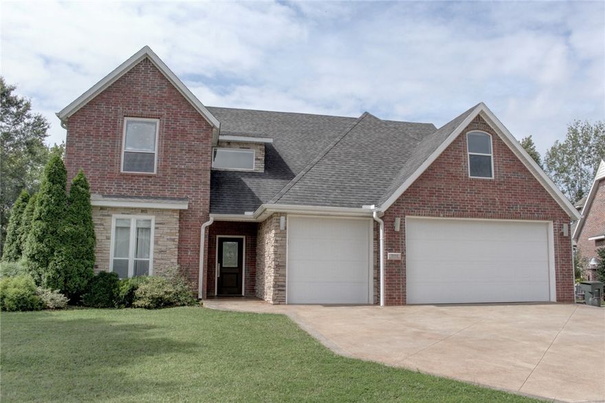 Conveniently located across from the Fayetteville Botanical Gardens, Lake Fayetteville, and Razorback Greenway trails, this 3,722 sq ft all-brick home blends modern design with efficiency. On a half-acre lot, it offers 4 bedrooms, 3.5 baths, and 5-Star Energy features including smart HVAC, wired for whole-house sound, LED lighting, instant hot water, and EV-ready garage. The main level showcases polished concrete floors, a chef’s kitchen with induction range, large island, smart oven, and walk-in pantry, plus a stylish floating staircase with under-bar and a stunning primary suite with whirlpool tub, dual vanities, and walk-in shower. Upstairs includes 3 bedrooms, 2 baths, an extremely spacious media/game room, and a playroom with lofts. Outdoor living features a covered patio, fire-pit, hot and cold water in rear of house, 3-car garage, and gas line for grilling, backing to a creek with room for a pool. Quiet neighborhood with sidewalks, near shopping, eating and more.