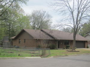 Nice sized single story brick home with 3 bdrms., 2 baths, (one with jetted tub), formal living room turned into a office with lots of nice built-ins. Also living room w/vaulted ceiling and fireplace with gas logs, formal dining room, kitchen, laundry room with pantry and more. Storage bldgs., covered patio & fenced yard.