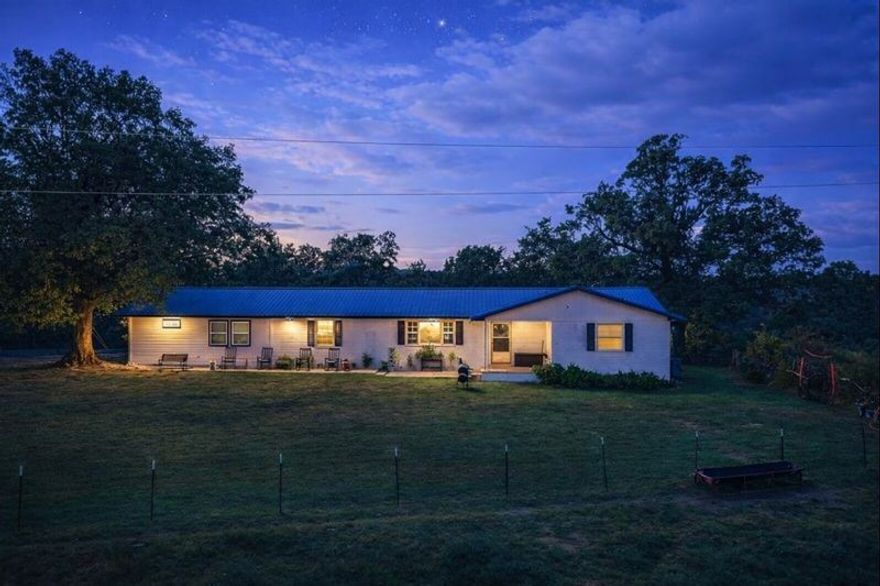 40 acres added! The additional acreage features two water taps and water lines ran for more properties to be built. Electric is already at the bottom 40 acres too! With the cost of everything going up this property gives you the opportunity to build a family compound and live the life you've always dreamed of. The best part? You're just 2 minutes from Highway 412 so you can get to all of NWA quickly. The current home on the property is designed for flexible multi-generational or multi-family living, while the surrounding land is perfect for livestock, gardening, and it has an inground pool. The storm shelter, barns, and shop add to this properties perfect design. Be sure to see the 3D Matterport tour and the survey. Also listed as mls 1326992