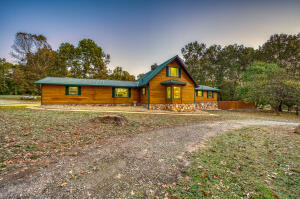 If you are looking for your own slice of paradise, look no further! This stunning 3 bedroom, 2.5 bathroom home sits on 8.89 gorgeous acres, featuring beautiful green fields with just the right amount of wooded land and a park-like front yard. This updated and move-in ready home has a modern, lodge feel and boasts a one-of-a-kind floor to ceiling fireplace, matching stainless steel appliances, waterproof vinyl plank flooring, attached two-car garage, fiber cement siding, a barn and large detached shop building. Home is less than 10 miles to Baxter Health and the middle of Mountain Home.
