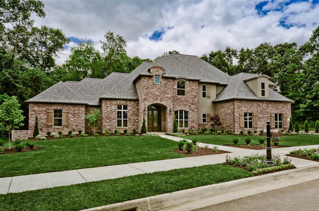 Imposing grace is expressed thru out. 6 Bedrooms(or 5 & a Bonus), 4 full baths, Powder Bath w/access to covered porch, all set up for entertaining including a fireplace. Private wooded lot adds to ambience of the living, kitchen, master and guest bedrooms. A Dream kitchen boasts Quartzite counters, custom cabinets, a massive island w/sink, KitchenAid appliance package. Media room, theatre equipped & a bar area. Stunning Master Suite, 2 walk-in closets, soaker tub, walk-in shower. Formal Dining, private guest bedroom (1st floor), and Study. Beamed ceilings, Wood floors, Designer fixtures enhance the craftmanship of this lovely home.