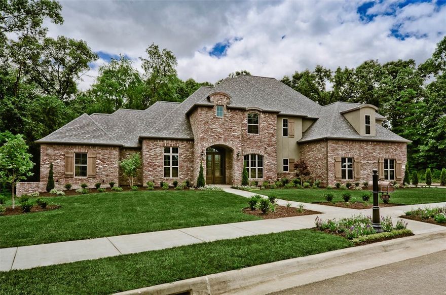 Imposing grace is expressed thru out. 6 Bedrooms(or 5 & a Bonus), 4 full baths, Powder Bath w/access to covered porch, all set up for entertaining including a fireplace. Private wooded lot adds to ambience of the living, kitchen, master and guest bedrooms. A Dream kitchen boasts Quartzite counters, custom cabinets, a massive island w/sink, KitchenAid appliance package.  Media room, theatre equipped & a bar area.  Stunning Master Suite, 2 walk-in closets, soaker tub, walk-in shower.  Formal Dining, private guest bedroom (1st floor), and Study. Beamed ceilings, Wood floors, Designer fixtures enhance the craftmanship of this lovely home.