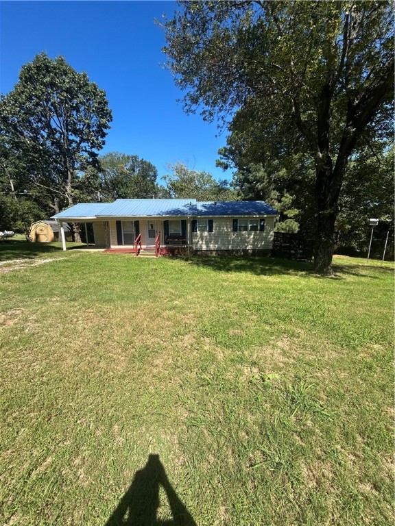 Nice home just outside of town.  Home has 3 bedroom, 1.5 baths, carport, vinyl siding, metal roof, new kitchen floor and fresh paint.  Also it has new kitchen cabinets, dishwasher , range and micro-hood.  HWA warranty is negotiable. New sewer line to septic tank