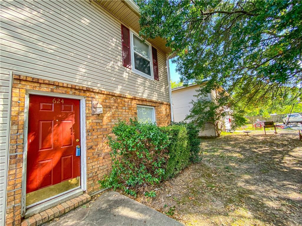 This property is convenient to I-49 and the U of A. You have vinyl plank flooring in the living room that leads to tile in the kitchen. In your kitchen you will find nice wood cabinets and counter tops. Off of the kitchen area will be your laundry room (washer/dryer included) and a half bathroom. Your two bedrooms will be upstairs and fit with nice carpet. Your full bath is upstairs in the hallway in between the two bedrooms. Lawn care is provided and paid for. Call today to schedule a showing!