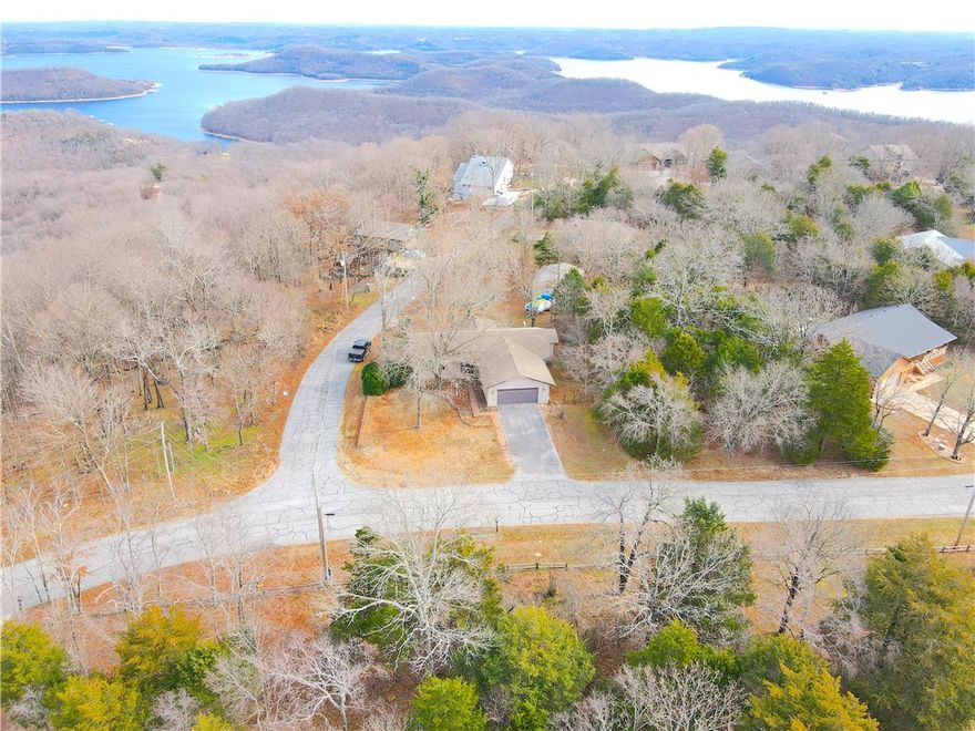 This charming home in the Beaver Lake area is a fantastic opportunity for those seeking
affordability and potential. Being 7 minutes from Lost Bridge Marina, this home is perfect for
any family looking to get out on the lake. Nestled on a corner lot in Lost Bridge Village, this 3-
bedroom, 2-bath residence features a spacious main living area with built-in storage. The
sunroom, with its double doors, seamlessly connects to a large back deck, making it ideal for
entertaining. An unfinished basement presents a blank canvas for customization, while the
24X30 workshop, complete with electricity, is perfect for hobbies and boat storage. Residents
can also enjoy the community recreation center, which includes a library, gym, pool, and
multi-use courts.