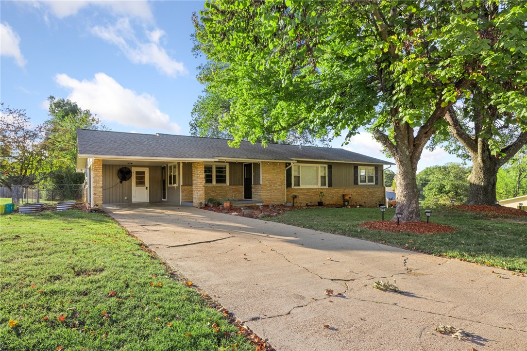 Itās time to find your new home! Nestled in the Ozark Mountains, Harrison offers all the amenities a town needs, and this beautifully remodeled 3-bedroom, 2-bath home perfectly combines small-town comfort with modern style. Step inside to find a beautifully updated kitchen with stylish finishes and generous cabinet space, along with a dedicated laundry/mudroom for everyday convenience. The open layout provides abundant living space, while the partially finished basement offers flexibility for an additional bedroom, home office, or entertainment area. The basement garage features a large workshop, ideal for hobbies or extra storage. Outside, unwind on the covered front patio or back deck, overlooking the fenced yard on a corner lot. A true move-in-ready gem!