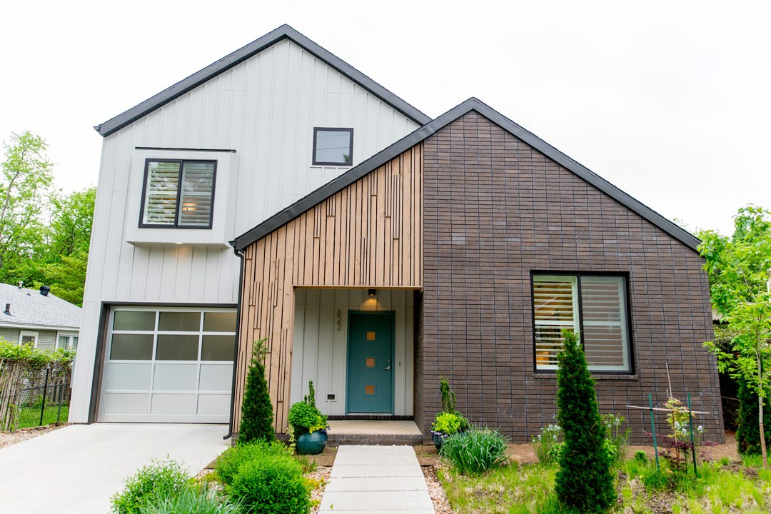Modern architecture in desirable Washington-Willow historic district. Open concept living areas w/high ceilings, lots of natural light. Oak slab island kitchen w/quartz counters, s/s appliances. Many fine details like Hickory wood floors, pocket doors, light dimmers, custom built-ins. Energy efficient construction/components. Master suite on main level w/deck access, 2nd living area + office up. Abundance of storage. Drought resistant landscape. Close to parks, schools, Dickson St, UA campus.