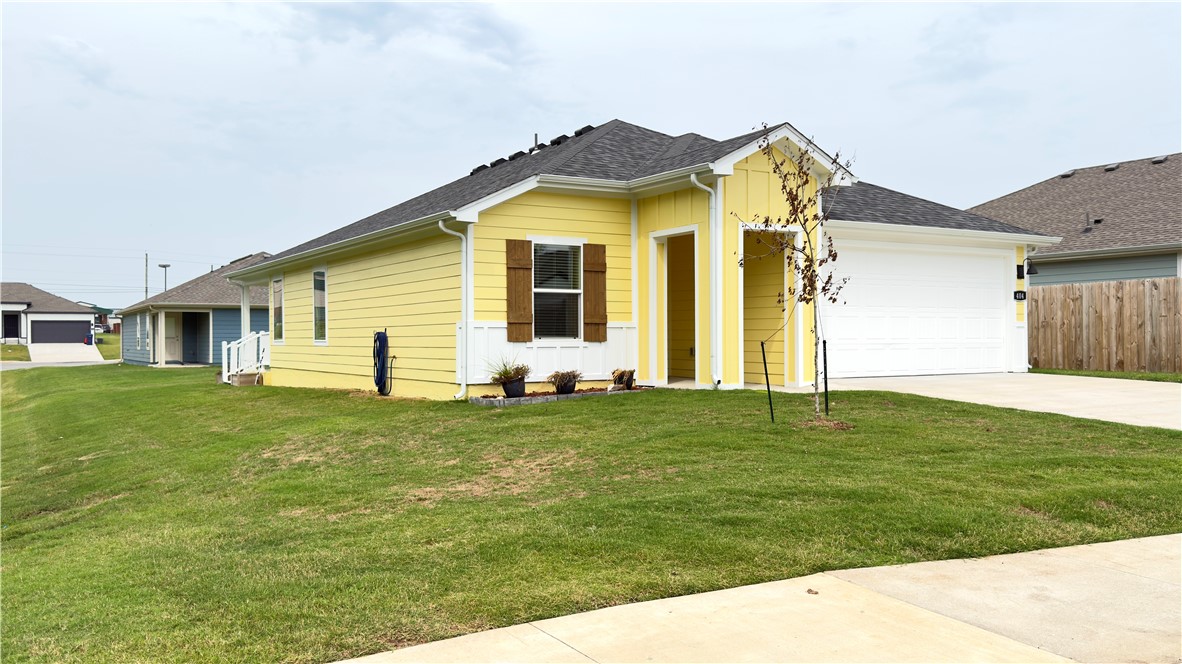 Welcome to The Commons in Siloam Springs! This like new home built in 2024 has 3-bed, 2-bath, separate dinning room (could convert to a home office or kids play room) 1,297 sq ft home features the popular Abbot plan with modern finishes and thoughtful design. Enjoy an open layout with a spacious living area, luxury vinyl plank flooring in main spaces, and carpet in bedrooms. The kitchen showcases 36-inch cabinets with crown molding, granite countertops, stainless steel appliances, and LED lighting. The private primary suite includes dual sinks and a walk in closet. Energy-efficient details include low-E windows, programmable thermostat, smoke detectors, attic storage and walkout covered patio.. Exterior features HardieĀ® siding, covered patio, landscaped yard, and a 2-car garage. Located just minutes from the Family Aquatic Center, Memorial Park, Bob Henry Park, and City Lake, plus easy access to schools and shopping. A perfect combination of quality, convenience, and styleāschedule your showing today!
