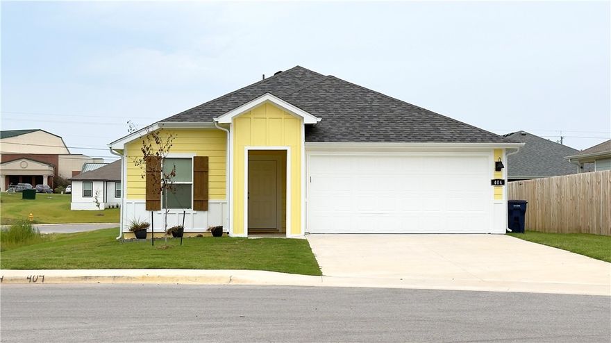 Welcome to The Commons in Siloam Springs! This like new home built  in 2024 has 3-bed, 2-bath, separate dinning room (could convert to a home office or kids play room) 1,297 sq ft home features the popular Abbot plan with modern finishes and thoughtful design. Enjoy an open layout with a spacious living area, luxury vinyl plank flooring in main spaces, and carpet in bedrooms. The kitchen showcases 36-inch cabinets with crown molding, granite countertops, stainless steel appliances, and LED lighting. The private primary suite includes dual sinks and a walk in closet. Energy-efficient details include low-E windows, programmable thermostat, smoke detectors, attic storage and walkout covered patio.. Exterior features Hardie® siding, covered patio, landscaped yard, and a 2-car garage. Located just minutes from the Family Aquatic Center, Memorial Park, Bob Henry Park, and City Lake, plus easy access to schools and shopping. A perfect combination of quality, convenience, and style—schedule your showing today!