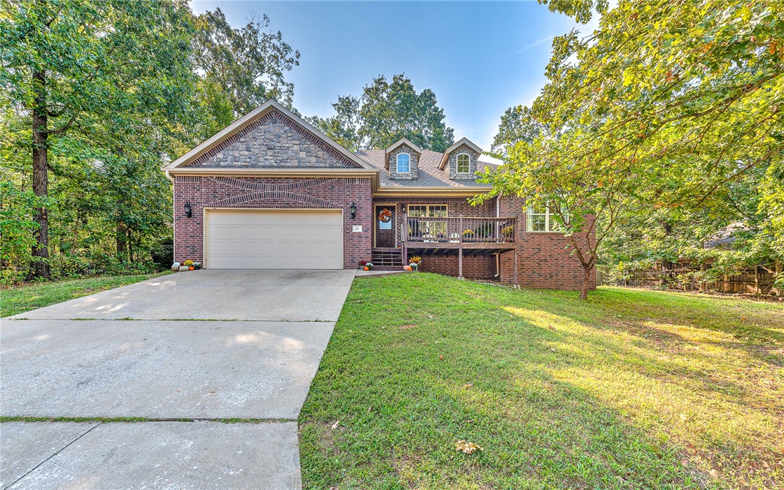 Tucked into the trees on a quiet Bella Vista street, this updated, level-entry brick home blends low-maintenance living with high-end comfort. Enjoy peace of mind with new appliances, new carpet in the back room and closets, and a fresh coat of paint that brightens every space. A cozy gas-log fireplace anchors the living room, while the refreshed deck is perfect for morning coffee or evening unwinding. The fully fenced, FLAT backyard offers privacy for pets, play, or gardening. The primary suite features not just one, but two walk-in closets and a deep soaking tubāyour own private retreat after a long day. Located just 2 miles from Back 40 Trails, Gear Garden, and Metfield Golf & Skills Park, adventure and relaxation are always nearby. With a smart layout, move-in-ready updates, and unbeatable access to lakes, parks, and trails, this home is a rare find in one of Bella Vistaās most sought-after pockets.