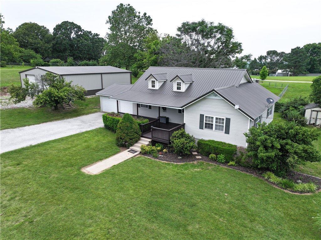 Charming traditional style home with room to roam! Come discover comfort and craftmanship in this beautifully designed 3-bed, 2-bath home located in the Valley Springs school district on 1 level acre. Inside you will find the split bedroom floor plan featuring many custom touches, like the engraved porcelain tile, nice hardwood cabinets and custom countertops in the kitchen, large built-in bookcase in the primary suite, and a multitude of handcrafted carpentry touches throughout. Step outside and discover the practicality of the two-car attached garage and the well-built 2,000 square foot red iron building with oversized doors and electric perfect for storage and hobbies. Exterior of the home also features a durable metal roof, covered porch, beautiful landscaping, and an RV hookup!