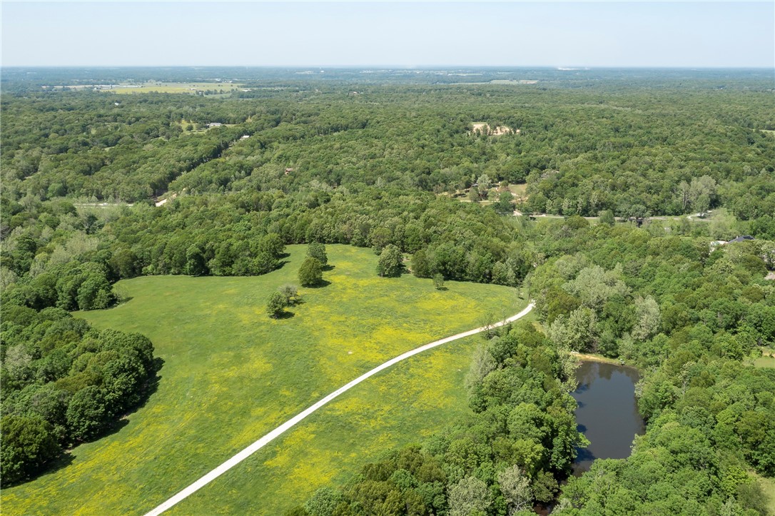 30.77 Acres. Come build your dream home. Development potential with several buildable locations. All utilities at street. Lake/pond on property. Back side of property has a stream.