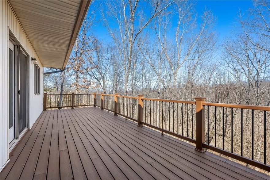 Unlock the potential of this 3,688 sq ft estate situated on a rare double lot. While the kitchen and bathrooms are ready for a modern revival—along with fresh paint and flooring—the high-ticket infrastructure is already pristine. Enjoy total peace of mind with a 2022 Heat Pump, 2020 Roof, 9 New Skylights (2020), and 2024 Gutters with Leaf Shields. This 4BR/3BA home features two sprawling living areas, two fireplaces, and a sunroom bathed in light. Outdoor living is perfected with a premium Trex upper deck and a freshly power-washed lower deck overlooking a zero-maintenance yard. Don't miss the 840 sq ft of ducted bonus space on the lower level! Priced to sell AS-IS (safety/health only), this is the ultimate blank canvas to create a high-end masterpiece in a rock-solid shell.