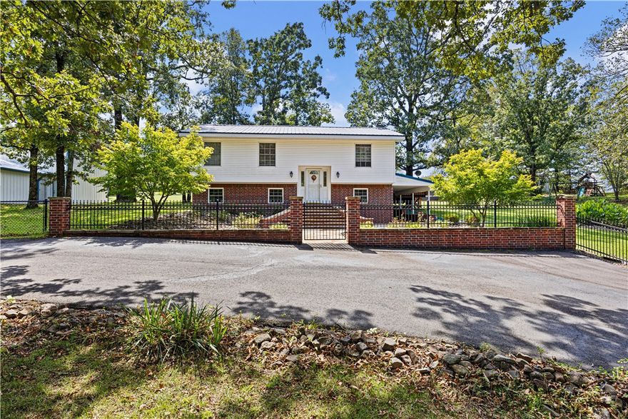 Welcome to this Charming 1888 sq ft 2-story home on 9.4 fully fenced acres with quality pasture. Inside features custom maple cabinetry throughout, 2 living areas, a cozy wood stove, and a walk-out basement with 2 rooms and a full bath. Upstairs offers 2 bedrooms, including the primary, and another full bath. Two spacious back decks overlook a park-like backyard—perfect for entertaining or relaxing—complete with beautiful landscaping and an above-ground pool. Property includes a well house, metal roof, and a separate barn with concrete floors in the pasture. The 600 sq ft insulated, heated/cooled garage/shop and the 960 sq ft insulated, heated/cooled RV building are standout features—ideal for storage, hobbies, or year-round work. Just 20 minutes to town!